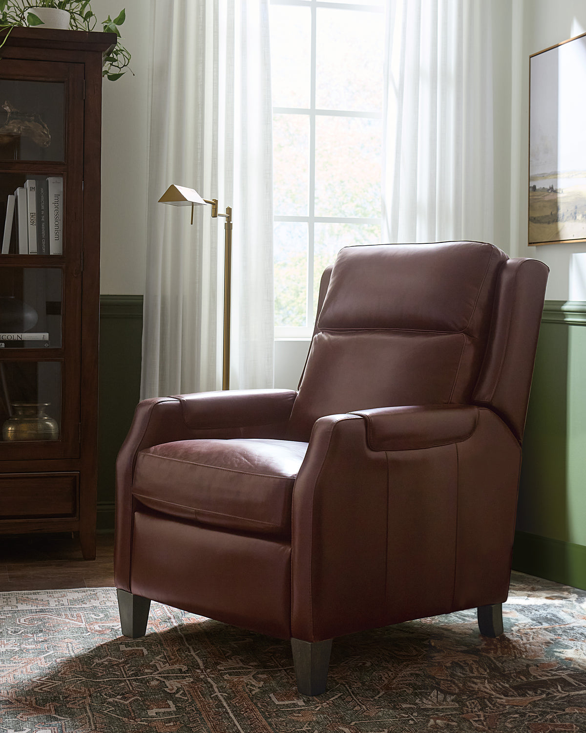 a brown leather chair in a room