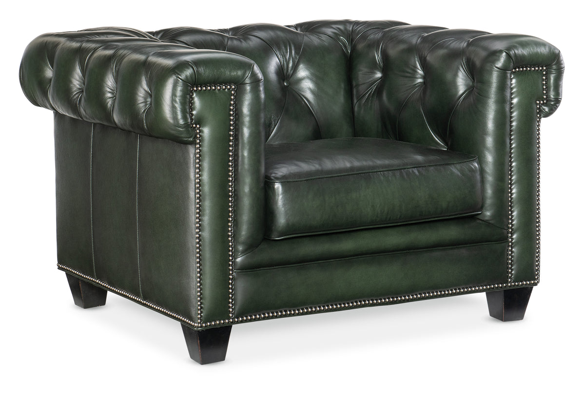 a green leather chair with black leather trim