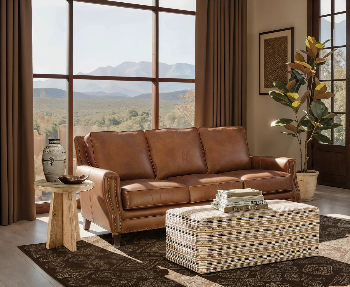a couch in a room with a large window