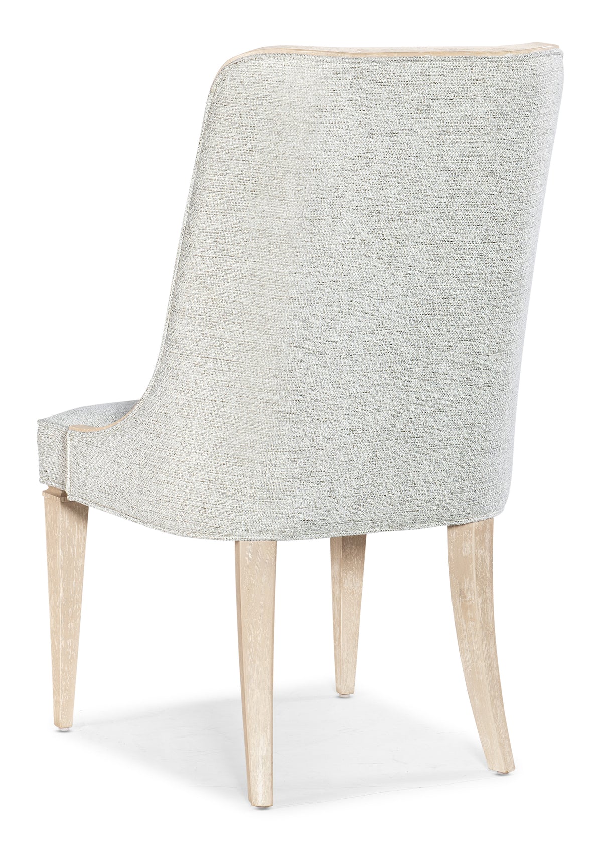 a white chair with wooden legs