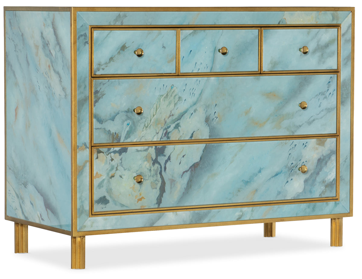 a blue and gold dresser