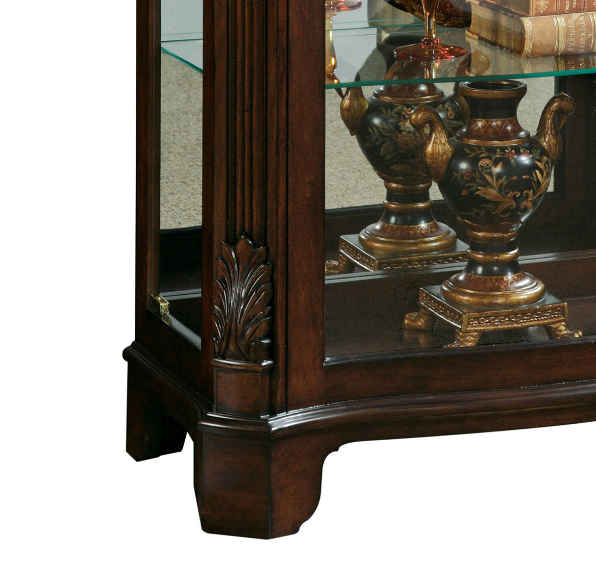 a glass cabinet with a vase on it