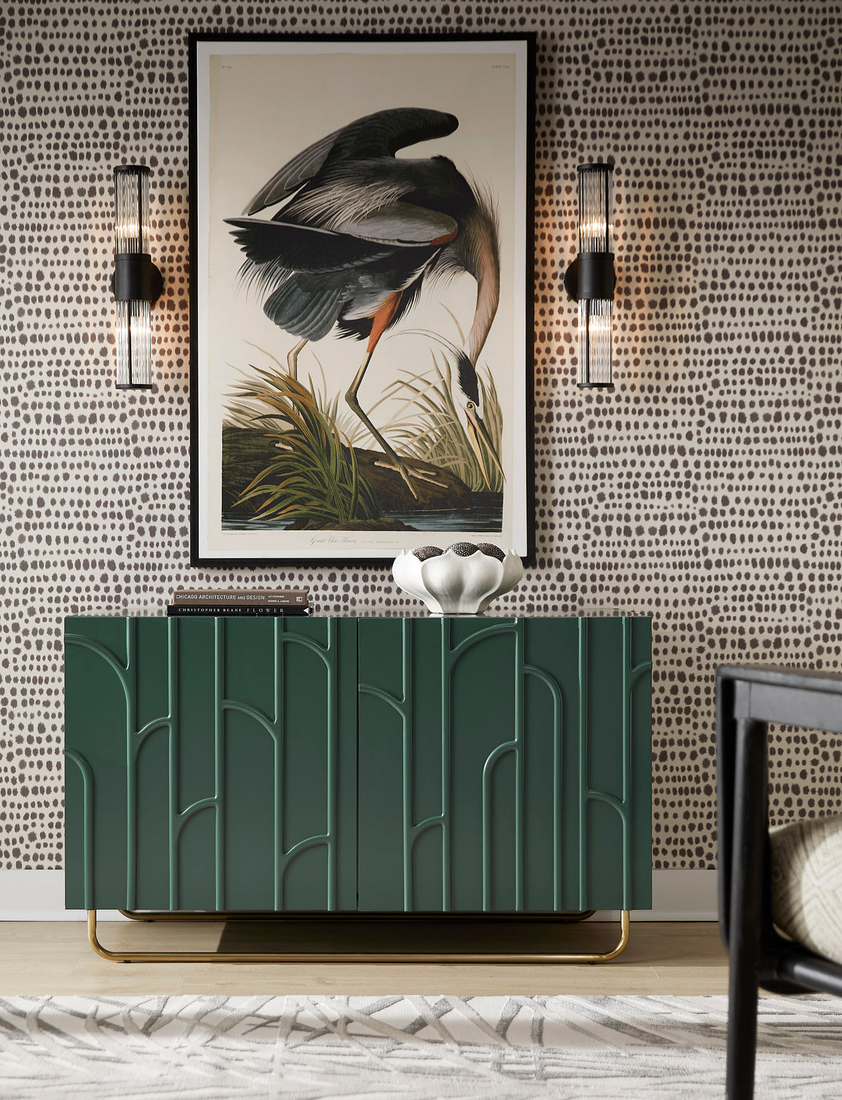 a green cabinet with a painting on the wall