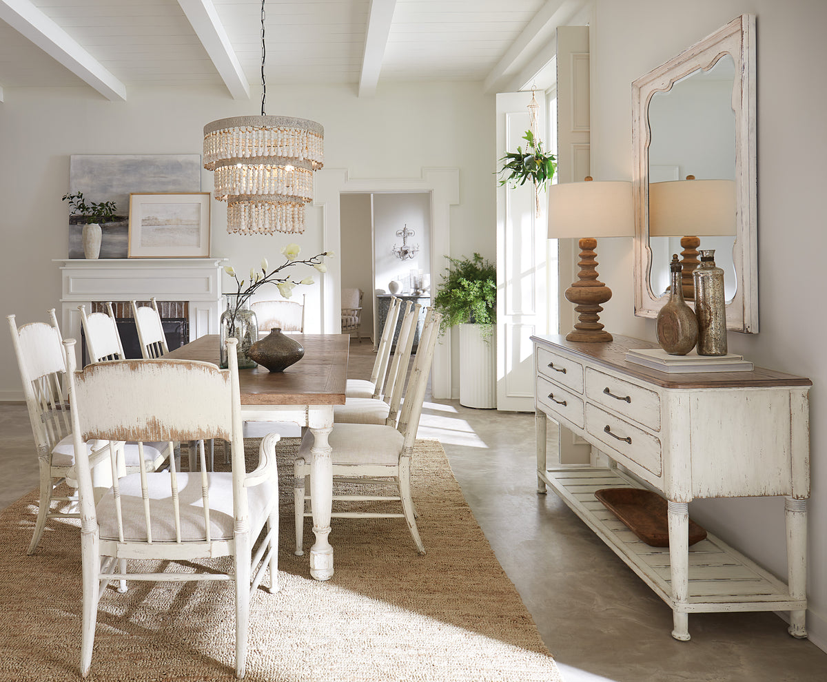 a dining room with a table and chairs