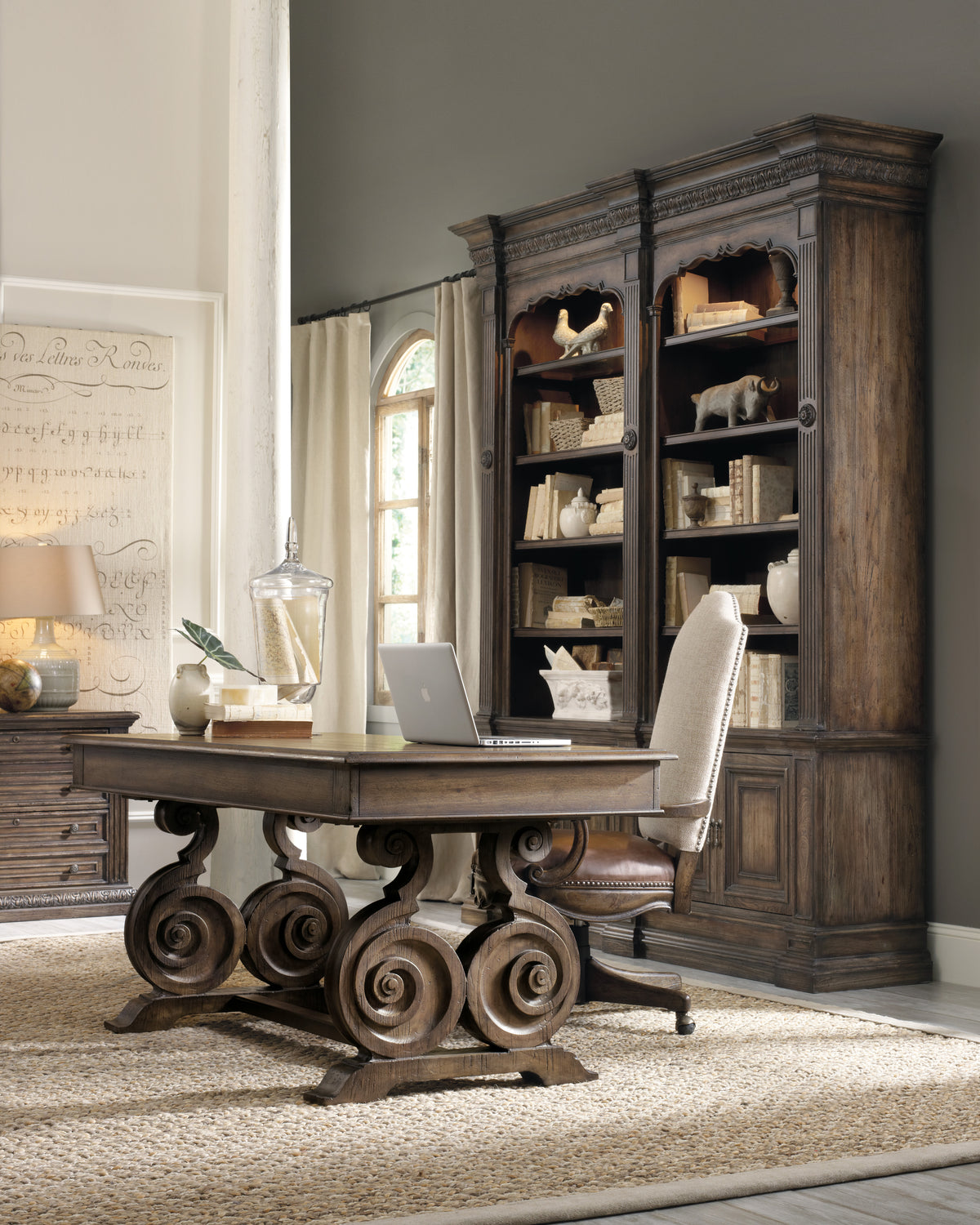 a desk in a room with a bookcase