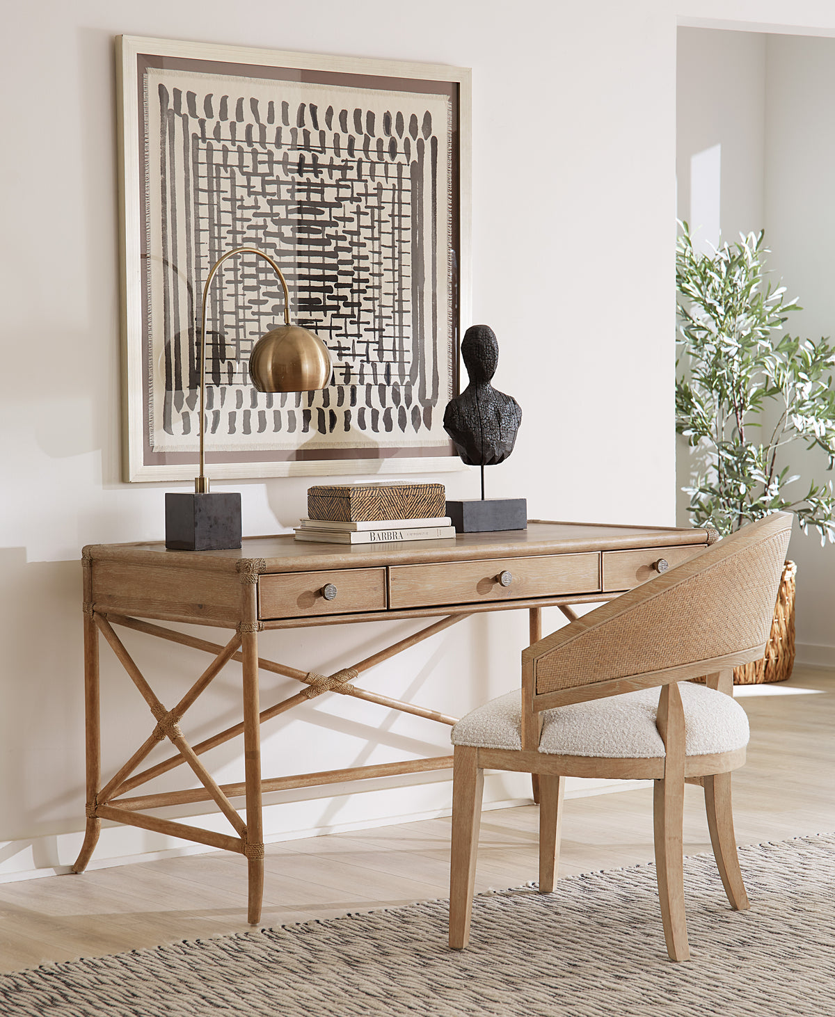 a desk with a chair and a lamp