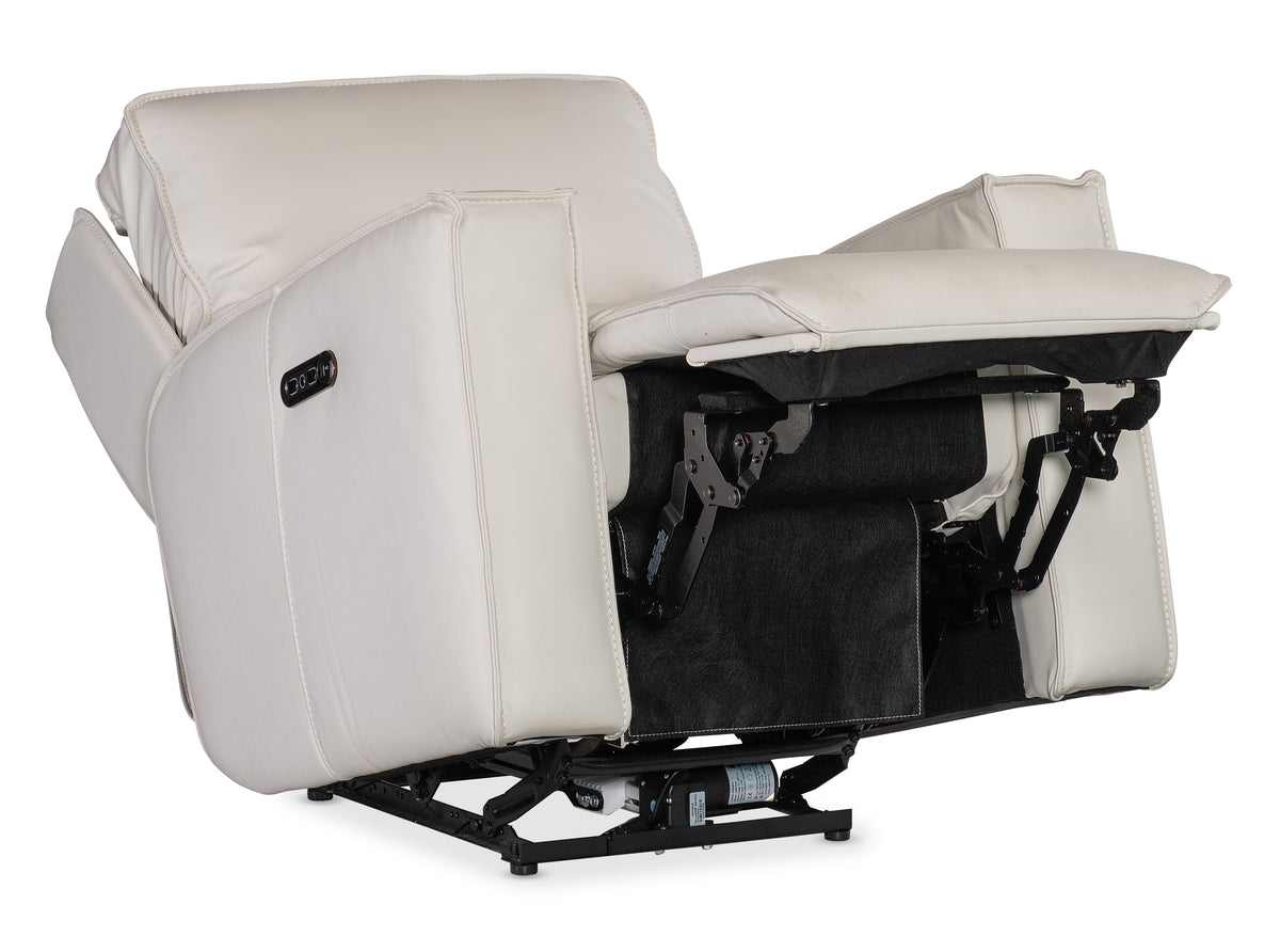 a white recliner with black legs