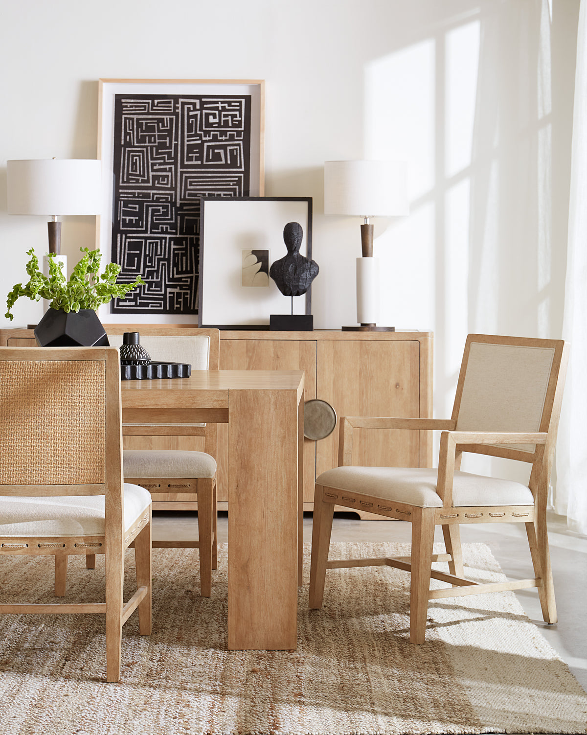 a dining room with a table and chairs