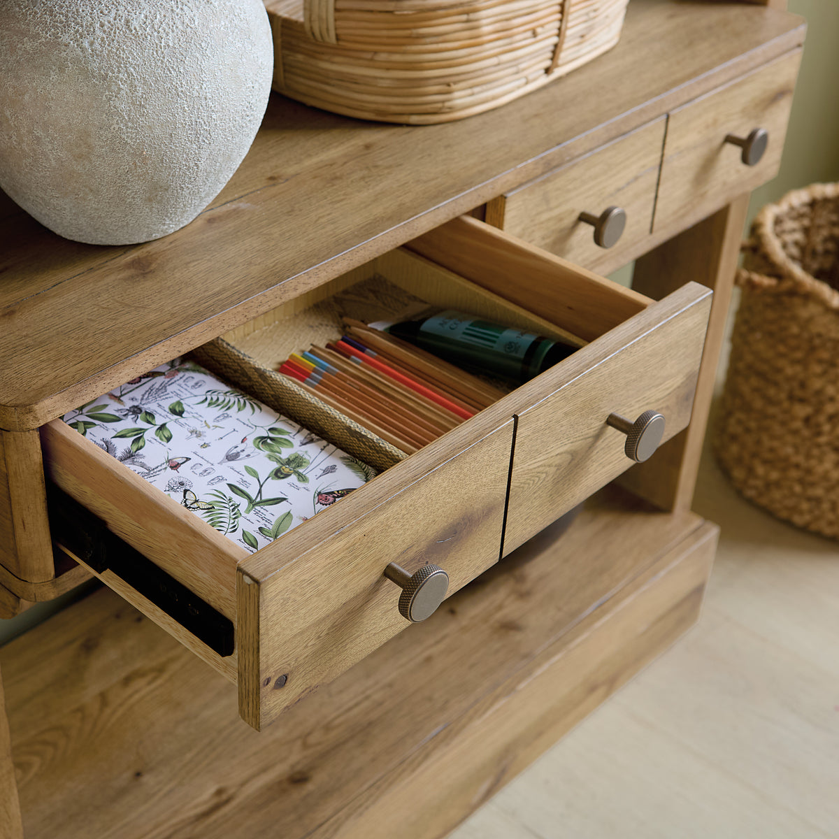 a wooden table with drawers open