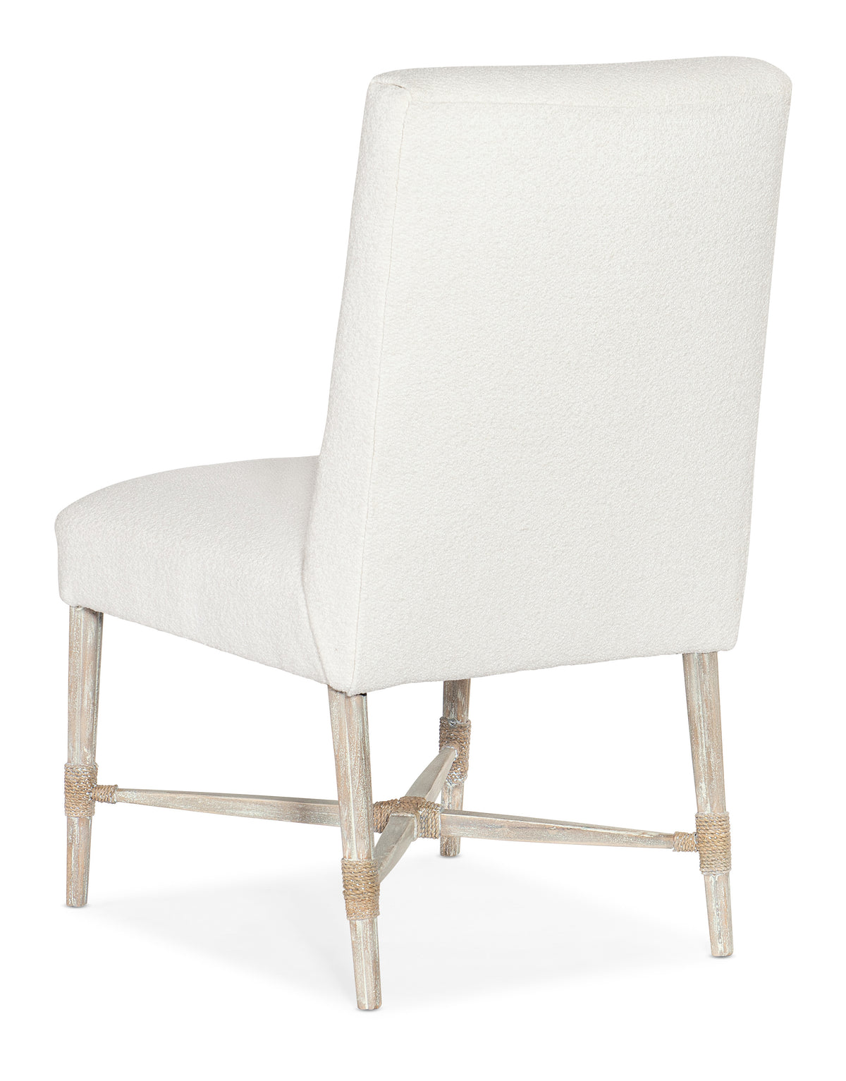 a white chair with wooden legs