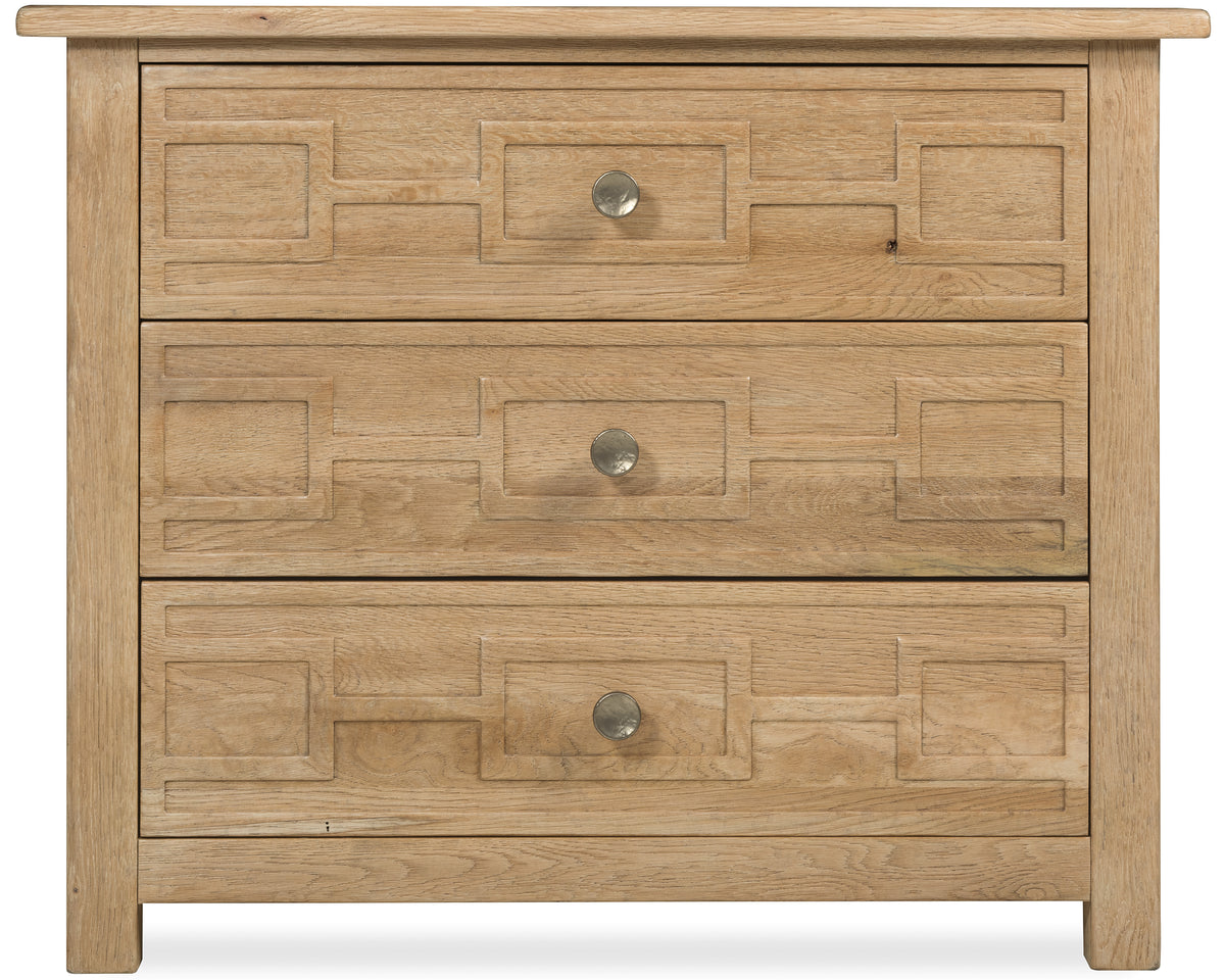 a wooden dresser with three drawers
