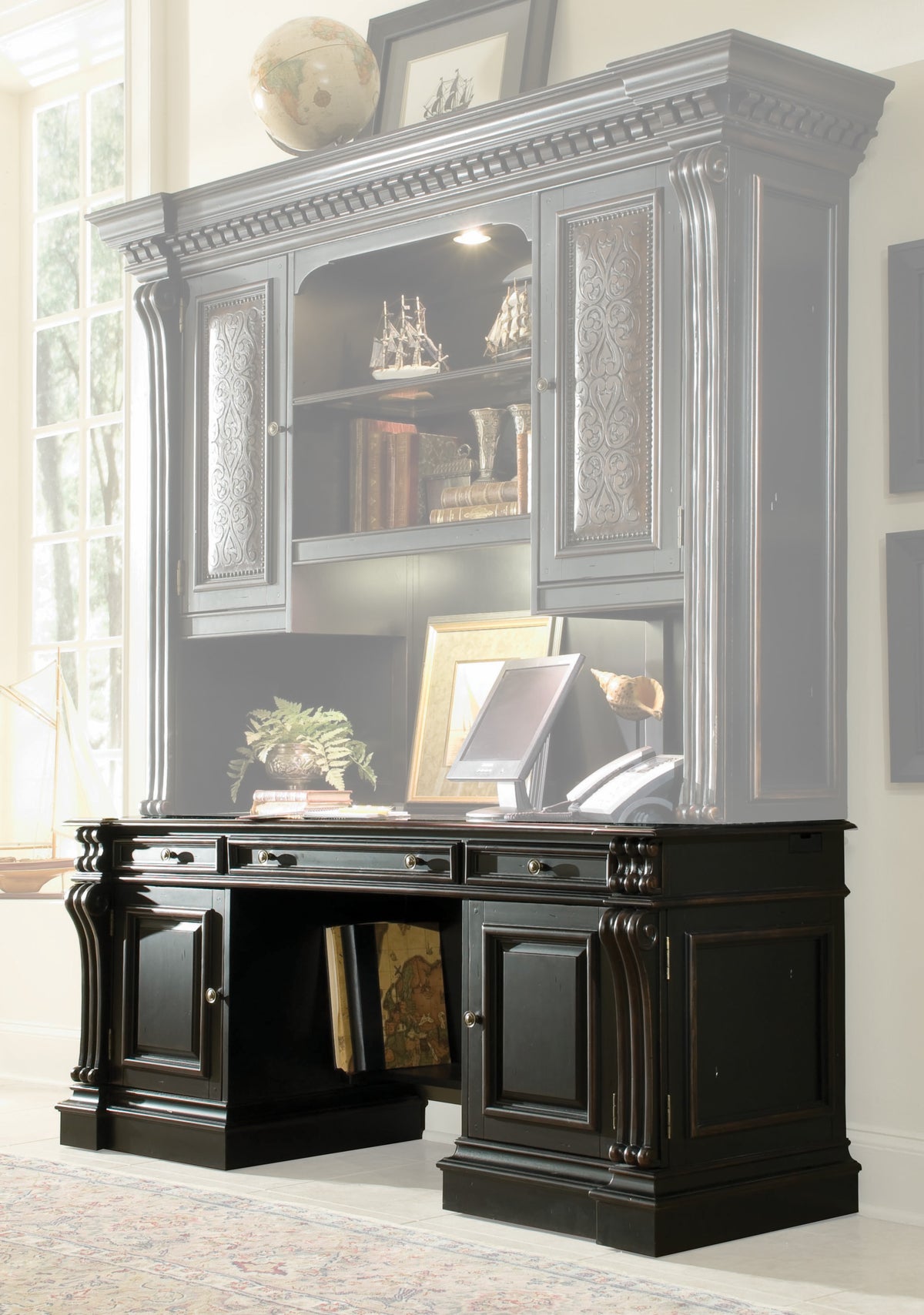 a desk with a shelf and books on it