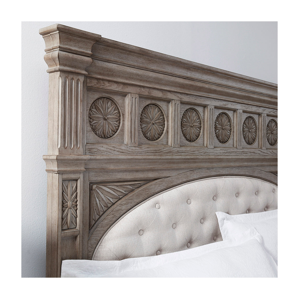 a bed with a white headboard