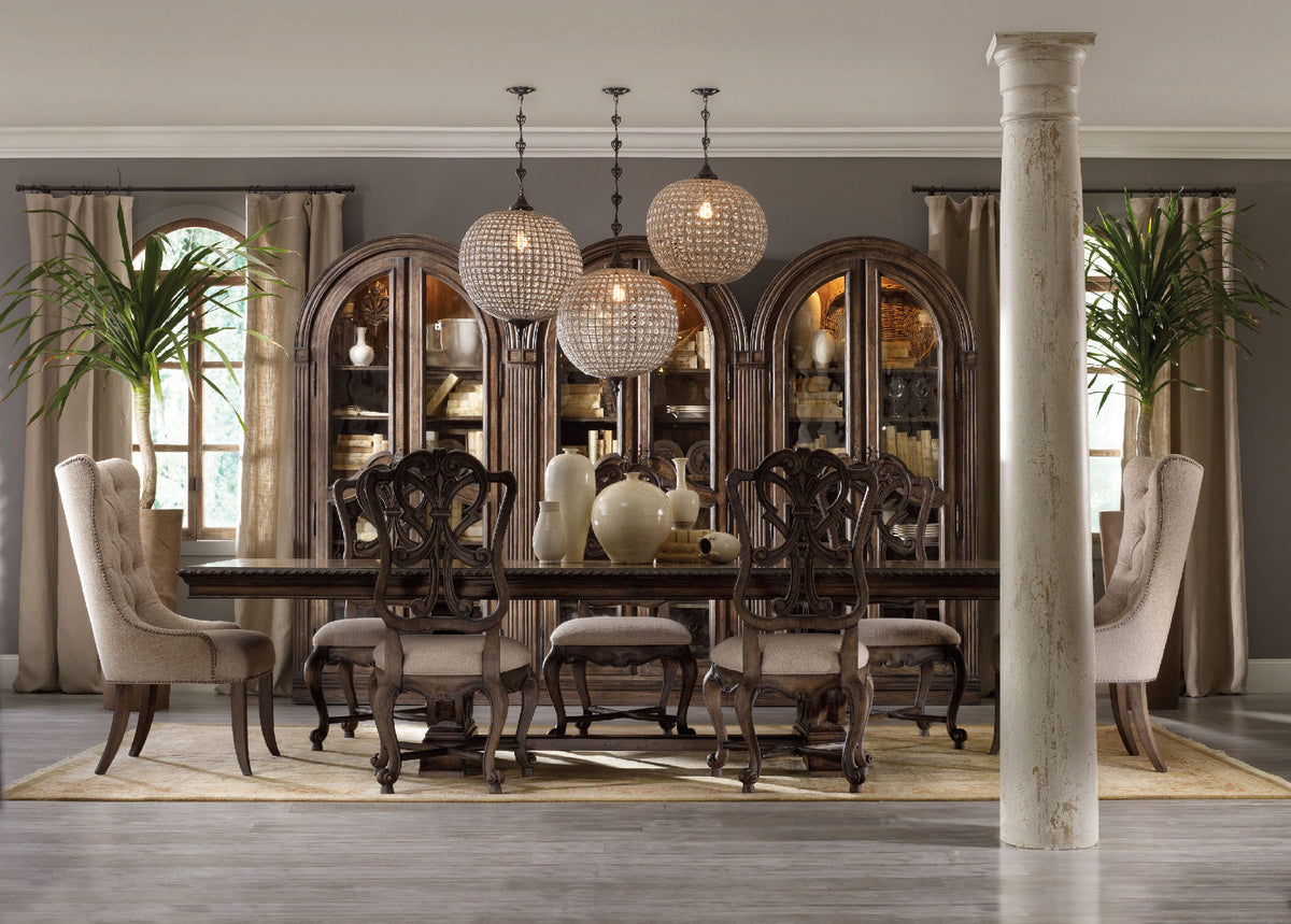 a dining room with a large table and chairs