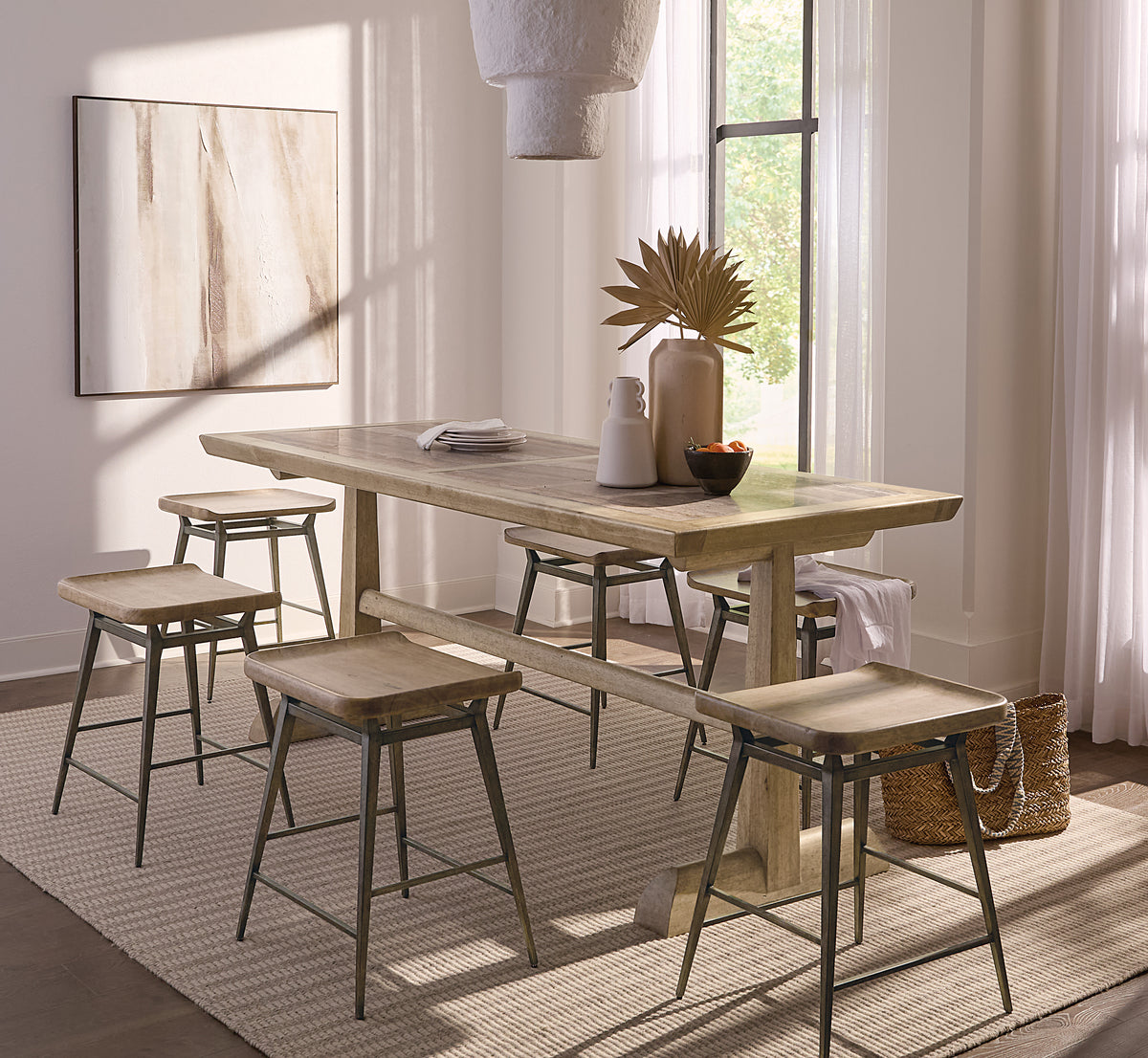 a table and stools in a room