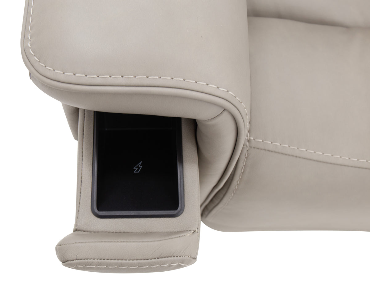 a recliner with a phone in the arm