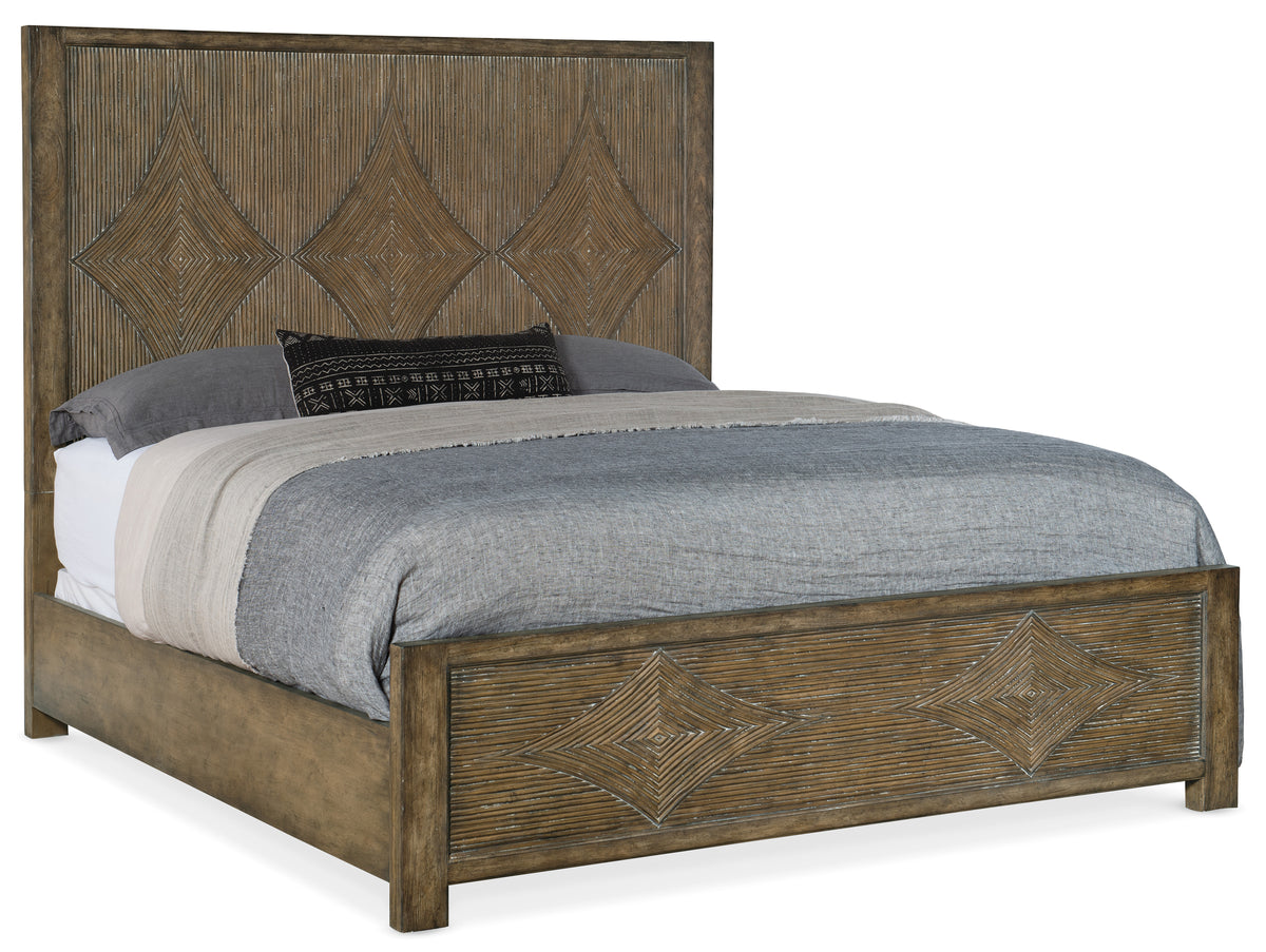 a bed with a woven headboard
