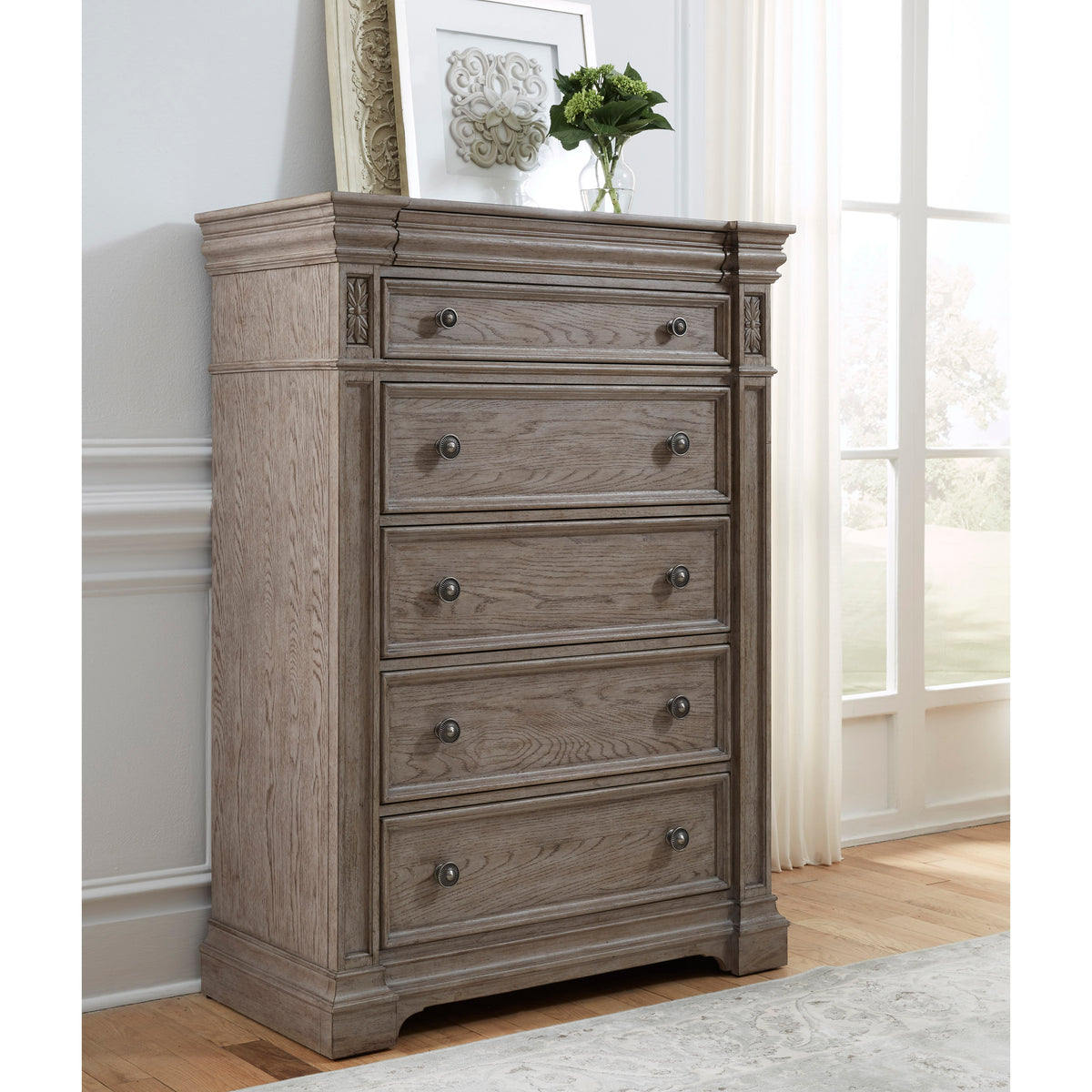 a dresser with a picture on top
