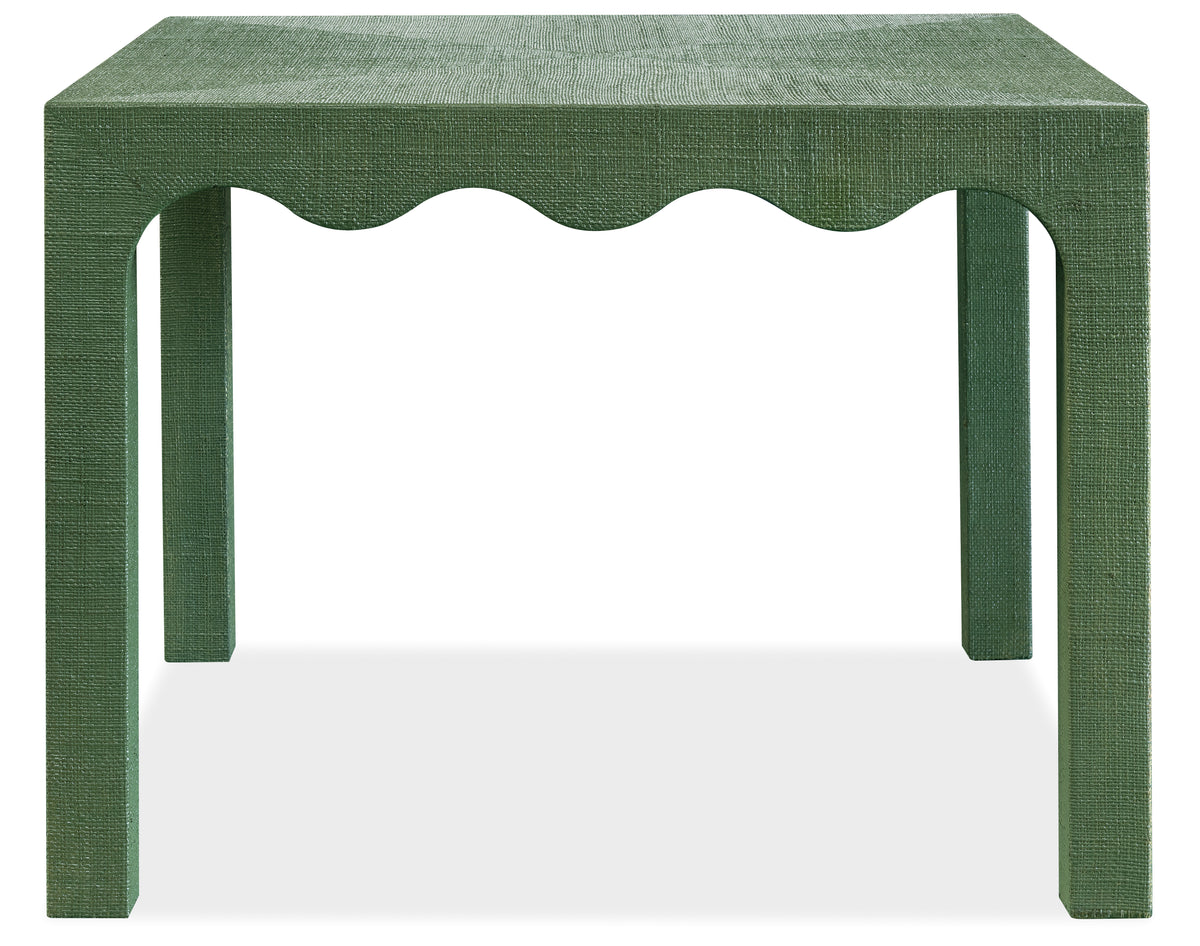 a green table with scalloped edges