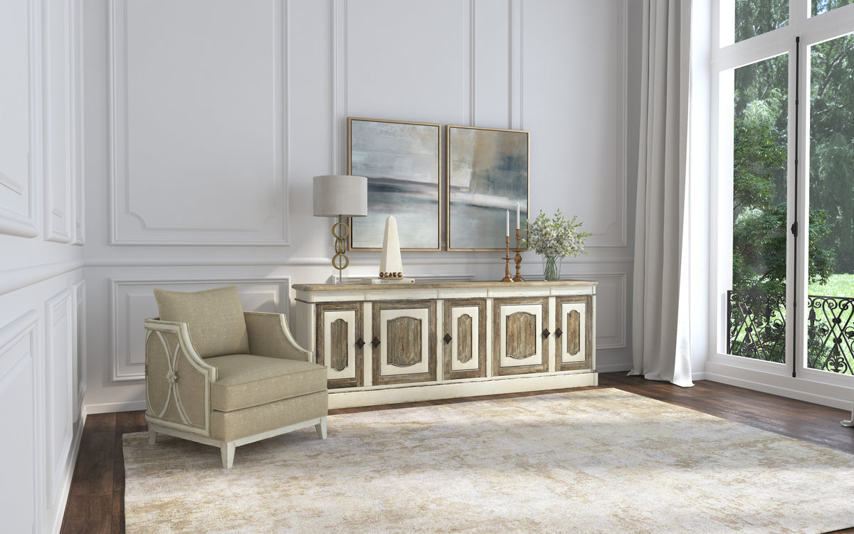 a room with a white wall and a white chair and a white dresser