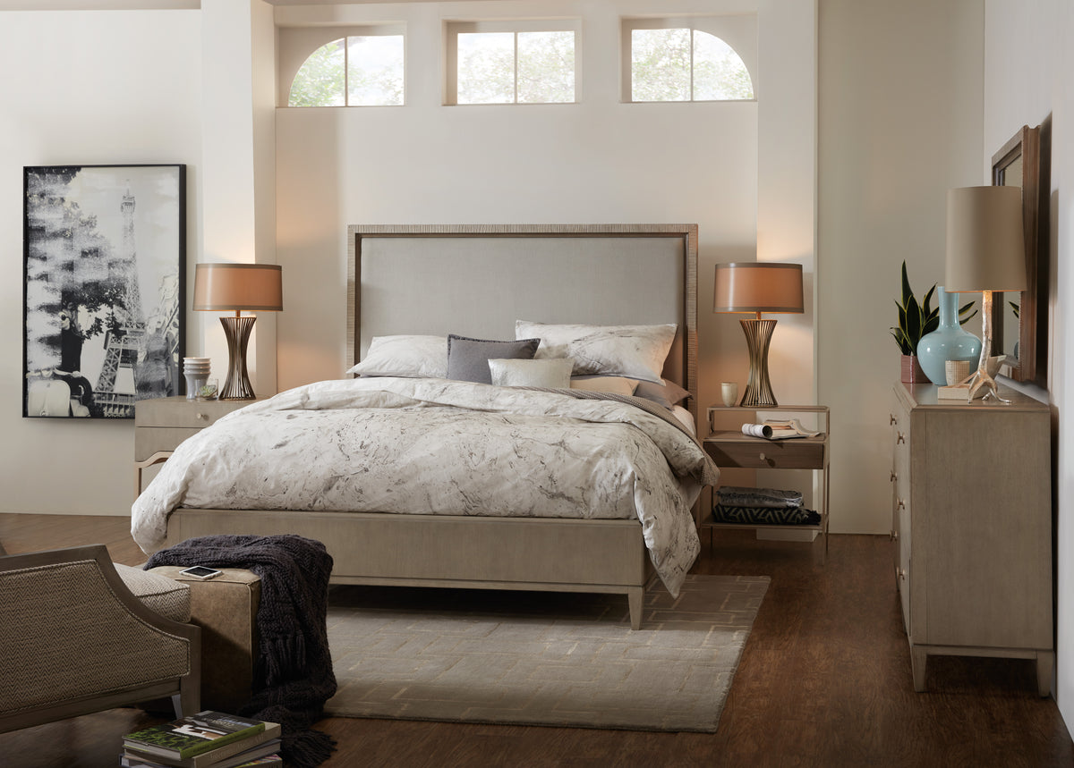 a bedroom with a bed and a rug