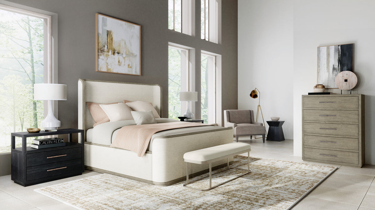 a bedroom with a bed and a chair