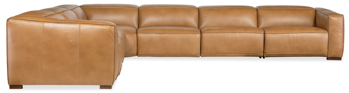 a brown leather couch with white base
