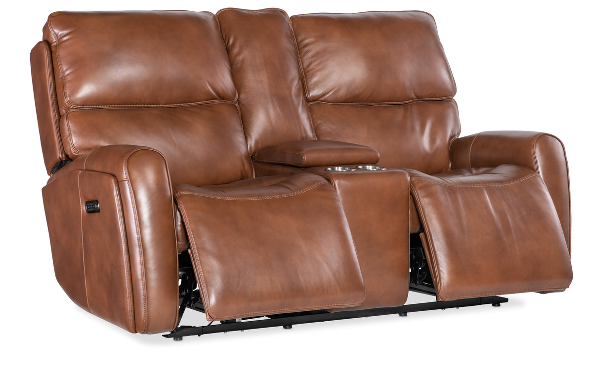 a brown leather couch with armrests
