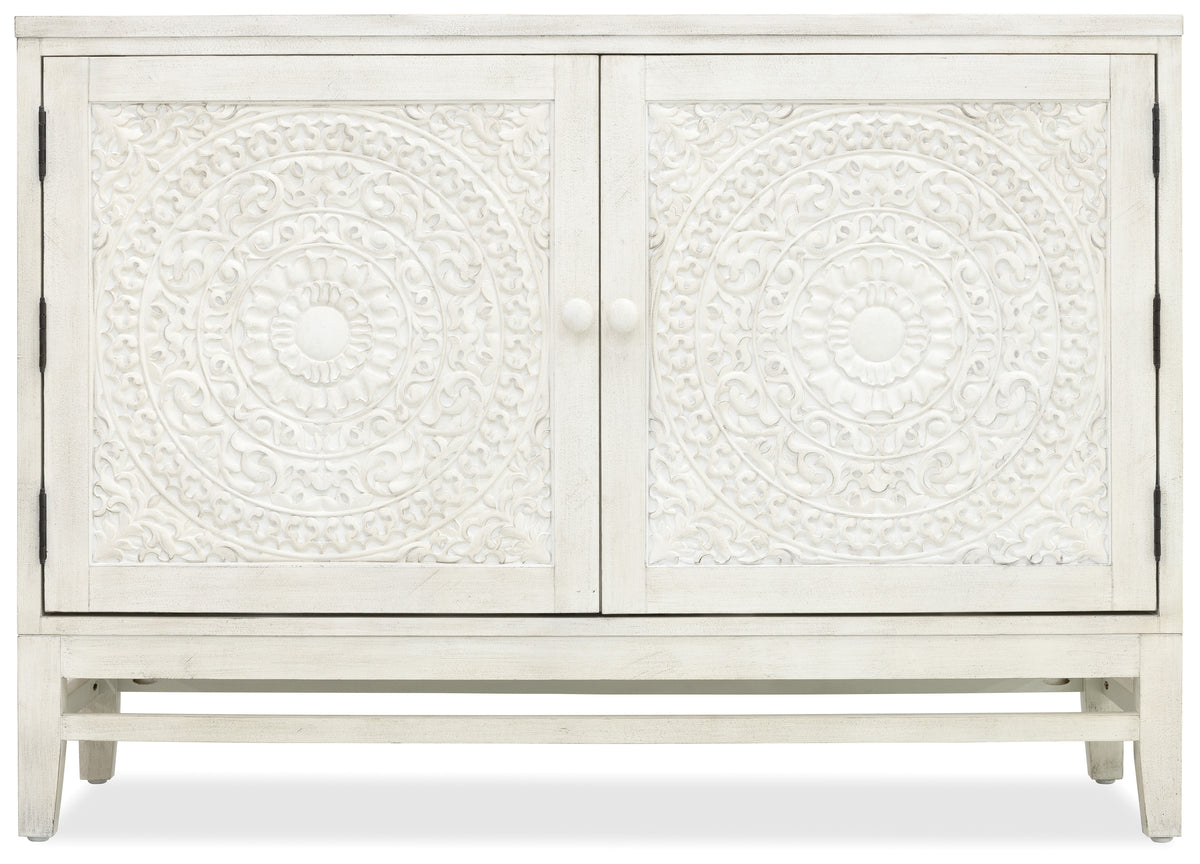 a white cabinet with a floral design