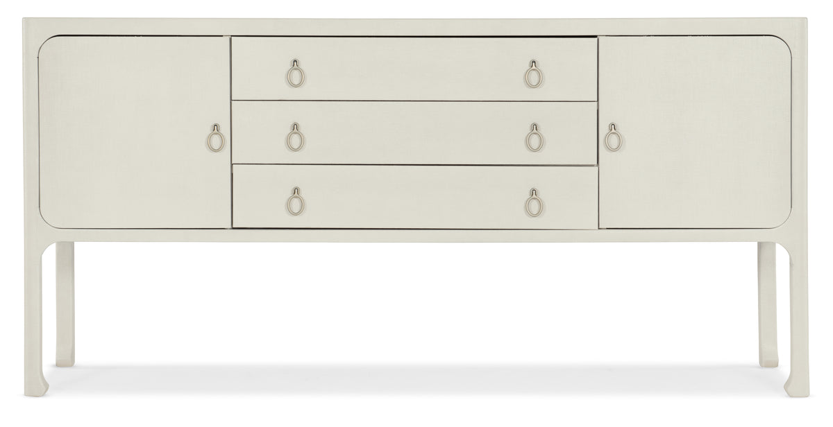 a white dresser with gold handles