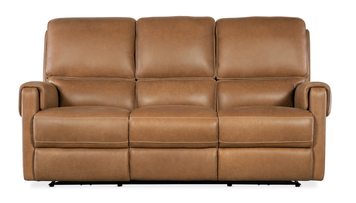 a brown leather couch with four reclining seats