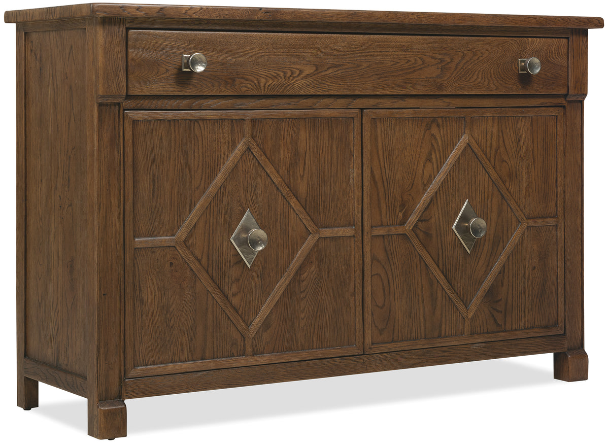 a brown wooden cabinet with silver handles
