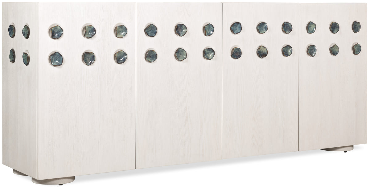 a row of white wood panels with holes in them