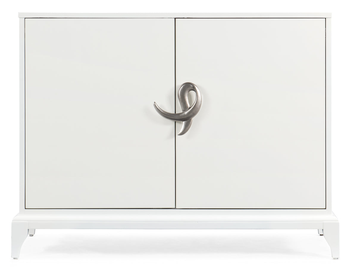 a white cabinet with a silver handle