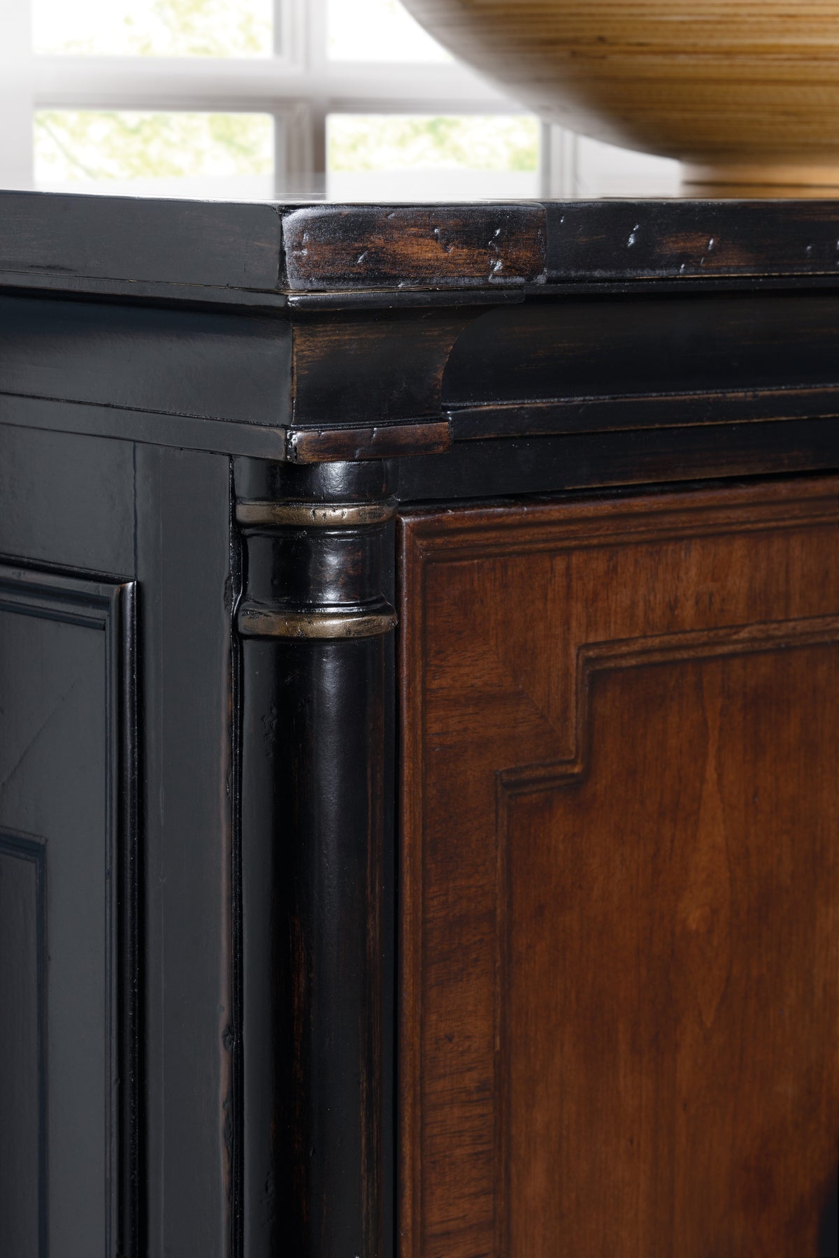 a corner of a wooden cabinet