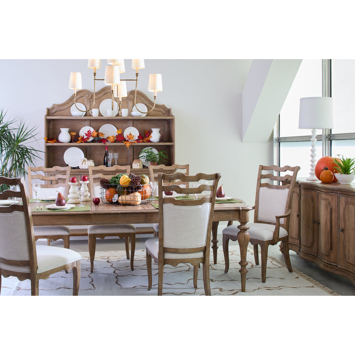 a dining room with a table and chairs