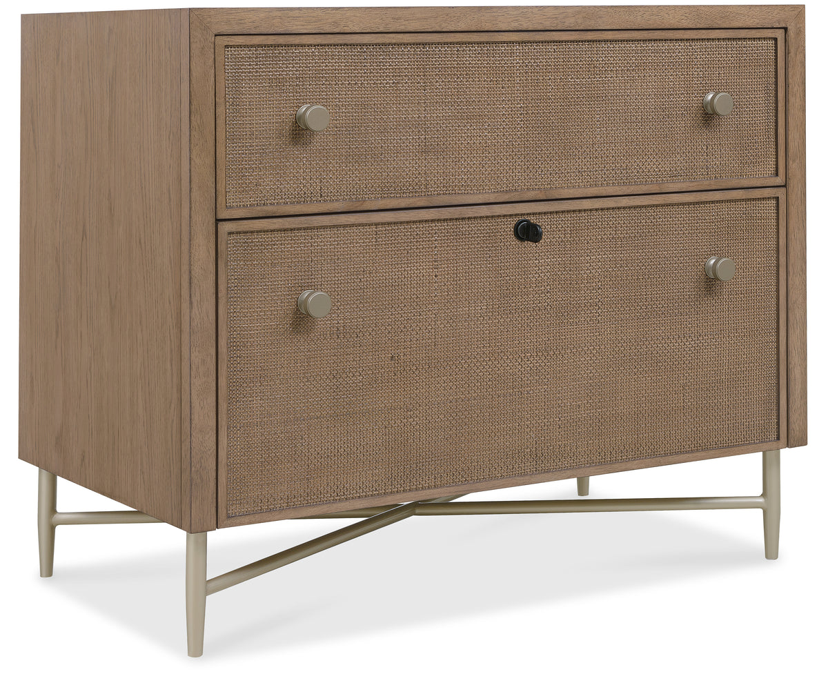 a brown dresser with silver knobs