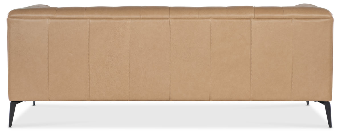 a back of a brown leather headboard