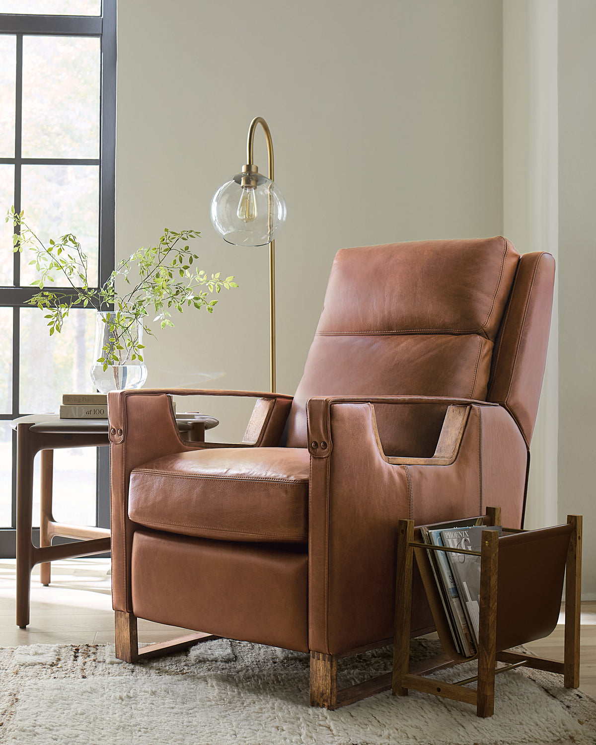 a brown leather chair in a room
