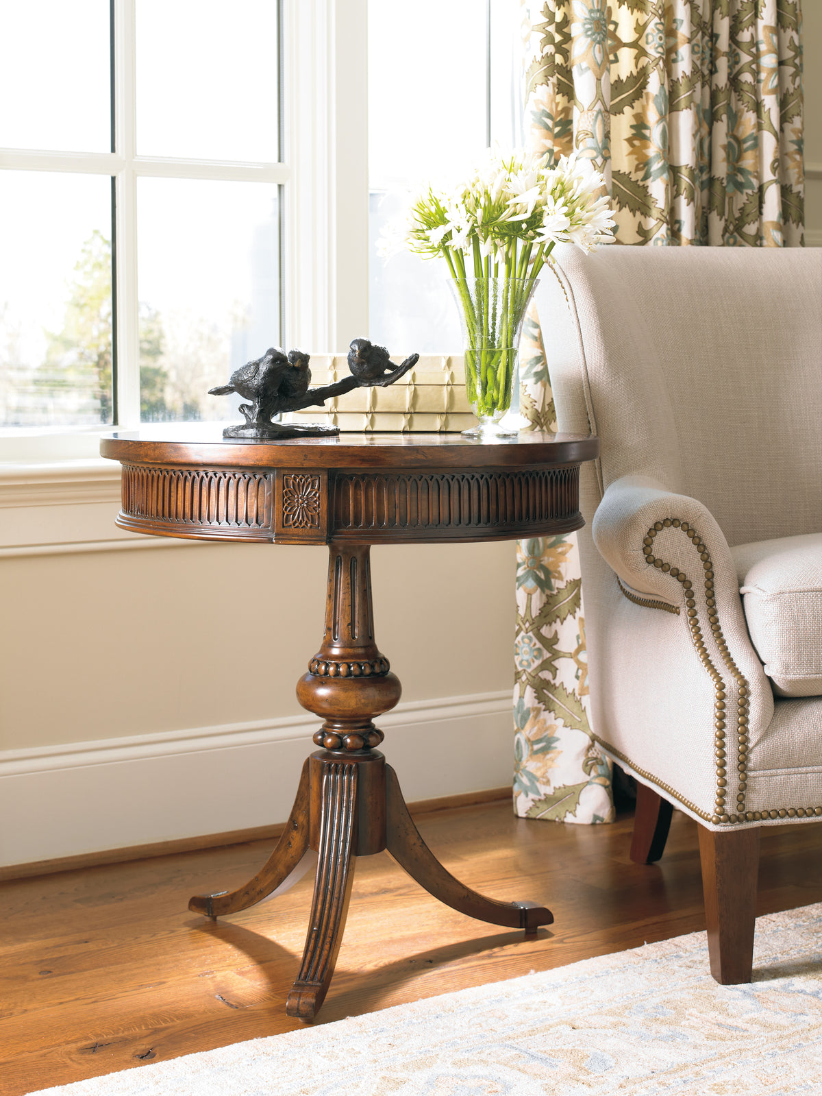 a table with a vase of flowers on it
