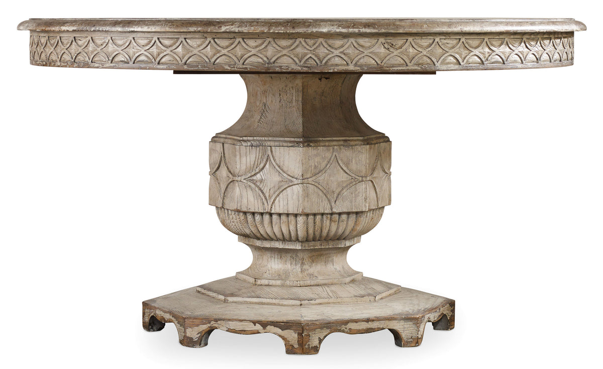 a white table with a carved base