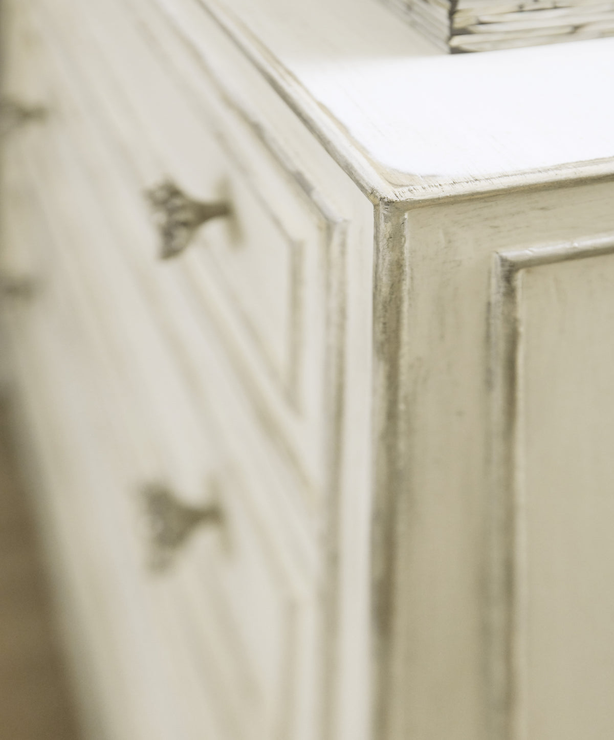 a close up of a white dresser