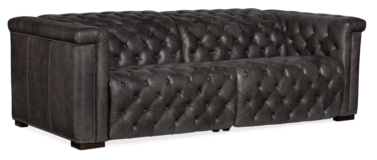 a black leather couch with buttons
