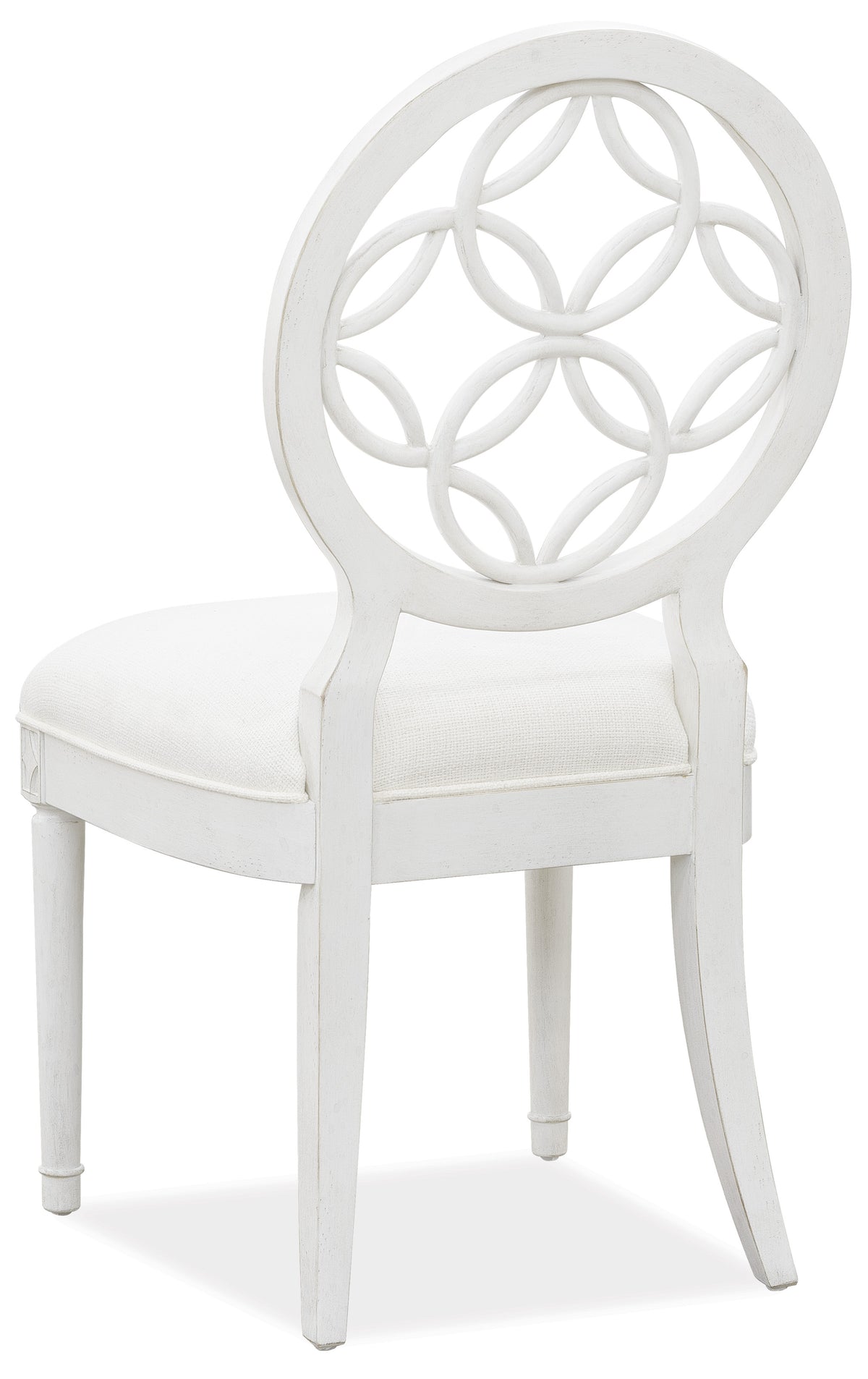 a white chair with a white cushion