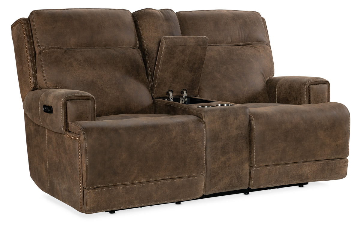 a brown reclining couch with a small coffee table