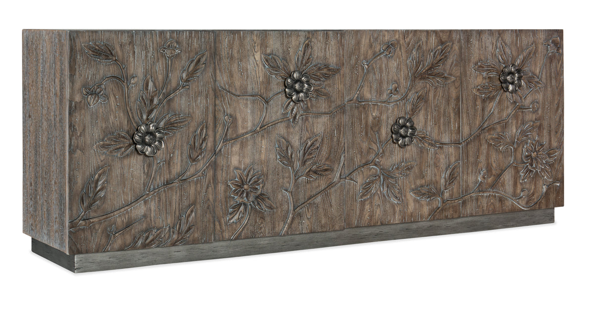 a wood panel with flowers carved on it