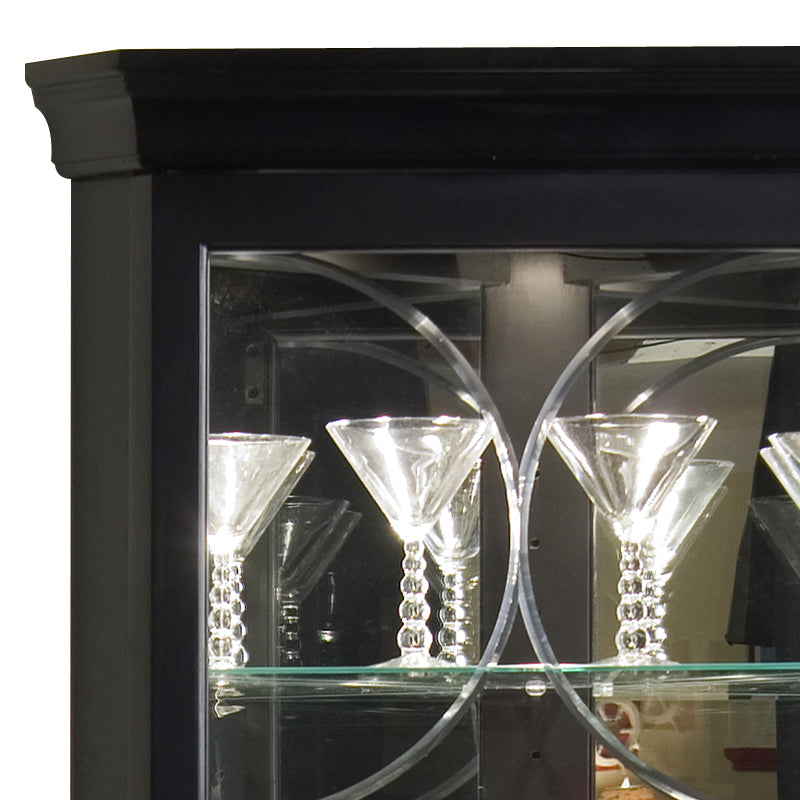 a glass display case with martini glasses