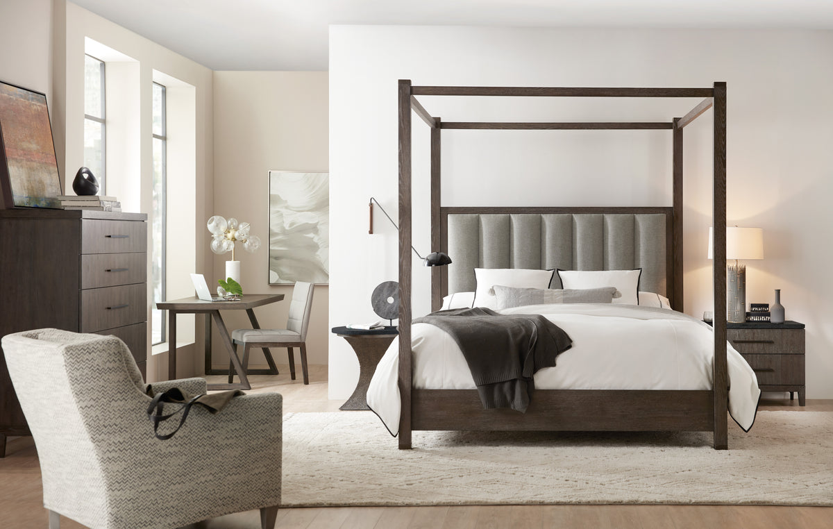 a bedroom with a bed and a chair