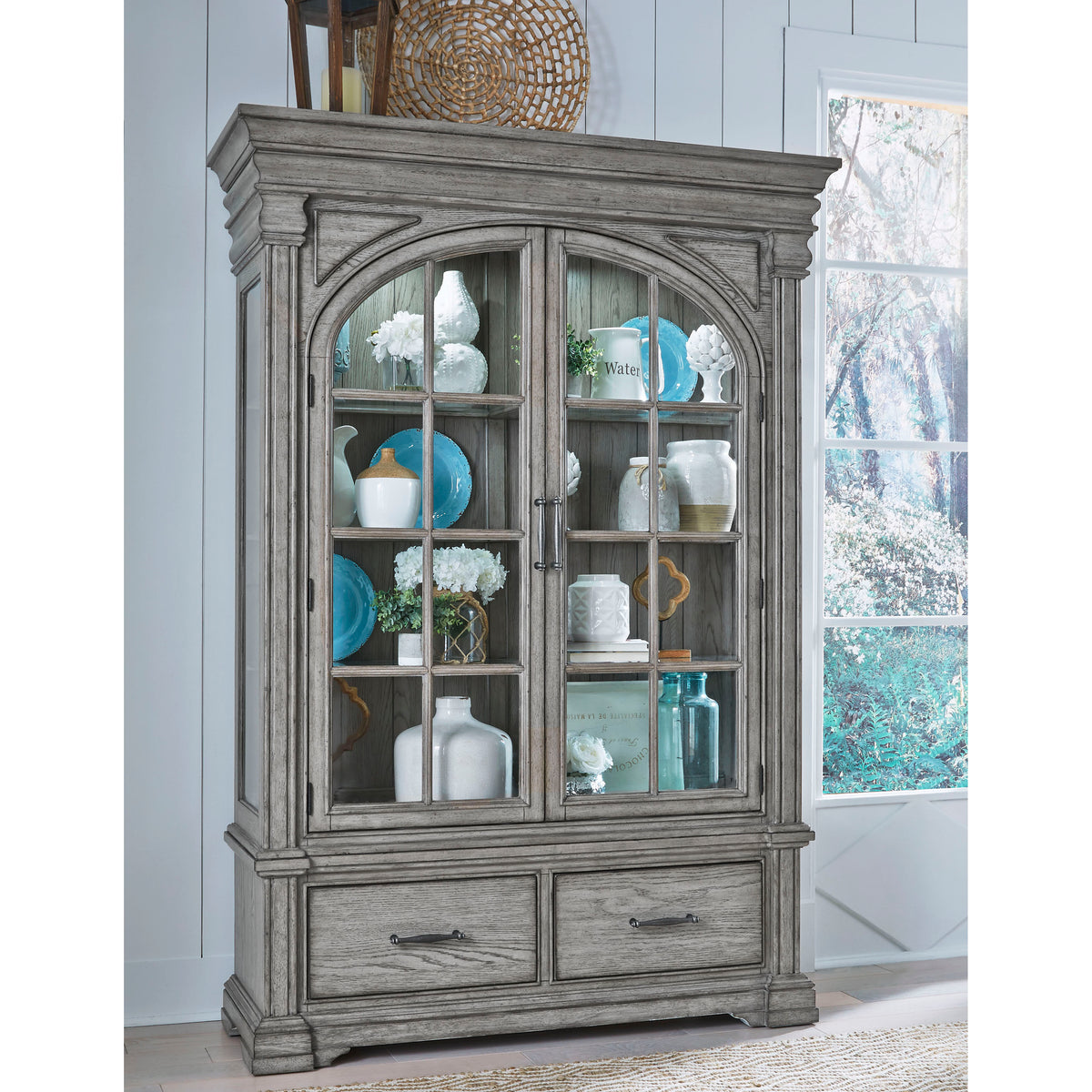 a grey cabinet with glass doors