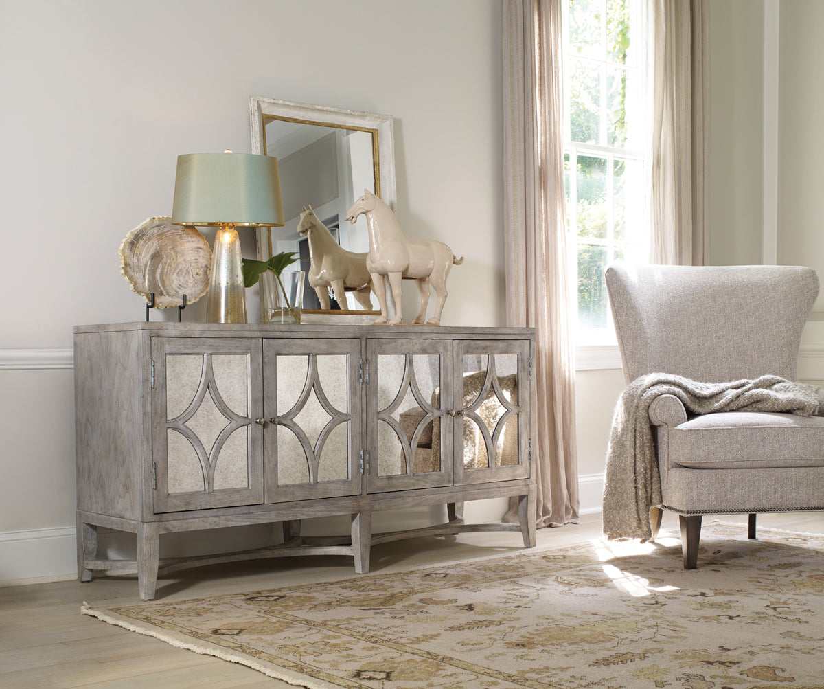a room with a mirror and a dresser